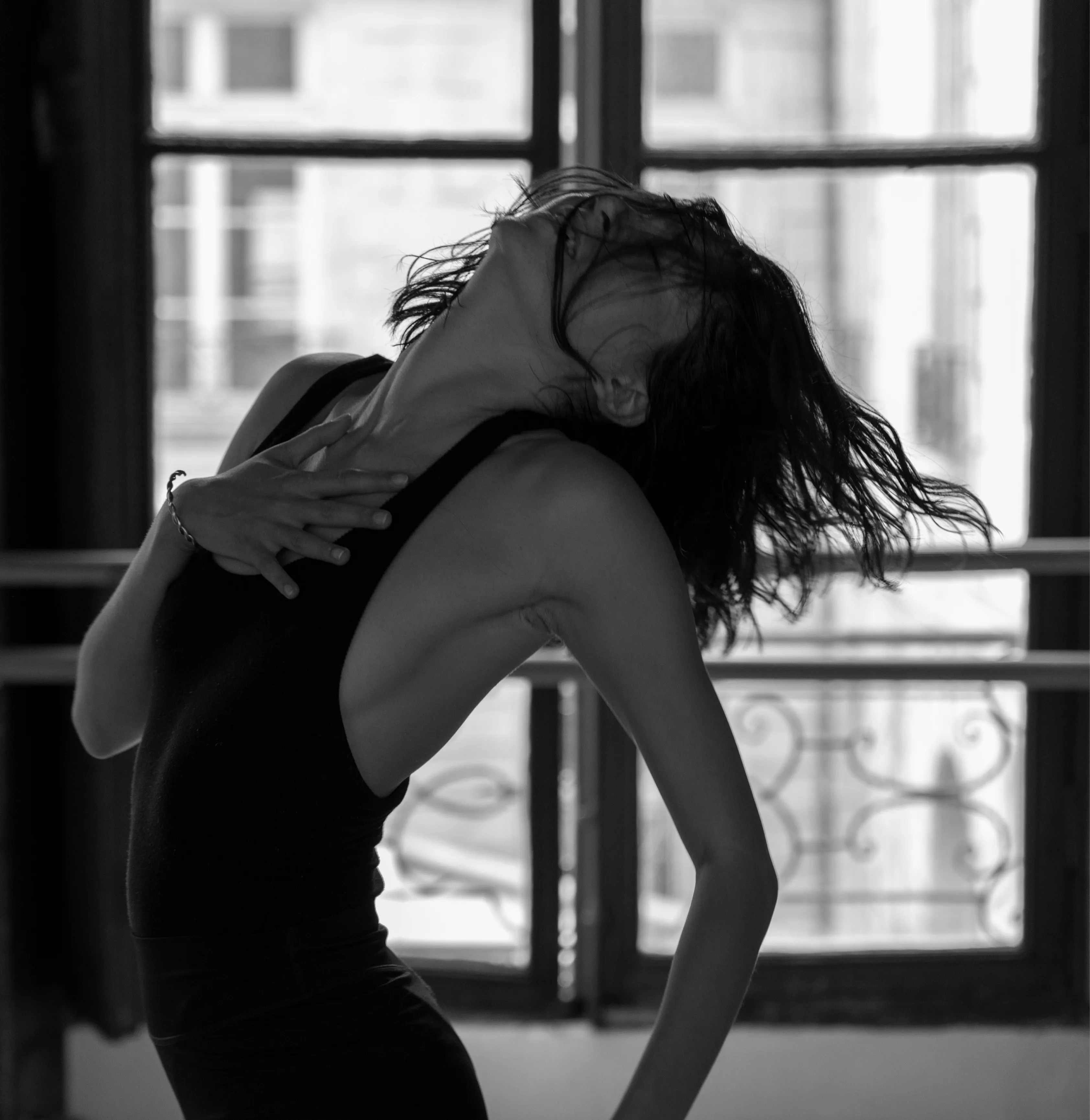 Mytam dancing in the studio, hand on her chest